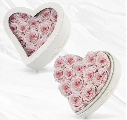 Big heart shaped box filled with multicolored roses